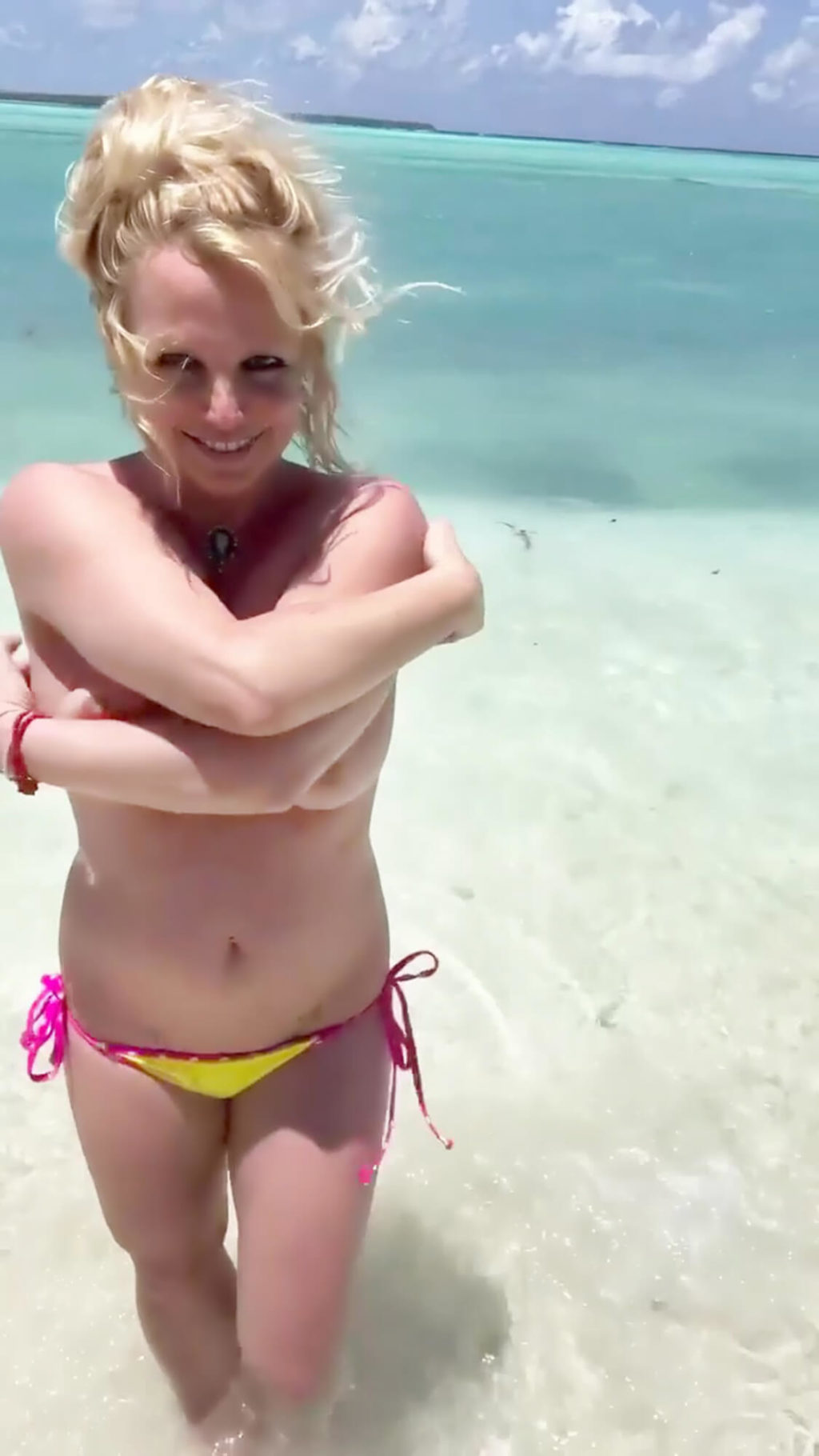 britney spears nude topless 06 1024x1820 - Britney Spears Flashes Her Nude Tits as She Poses Topless on The Beach (14 Enhanced Pics + Video)